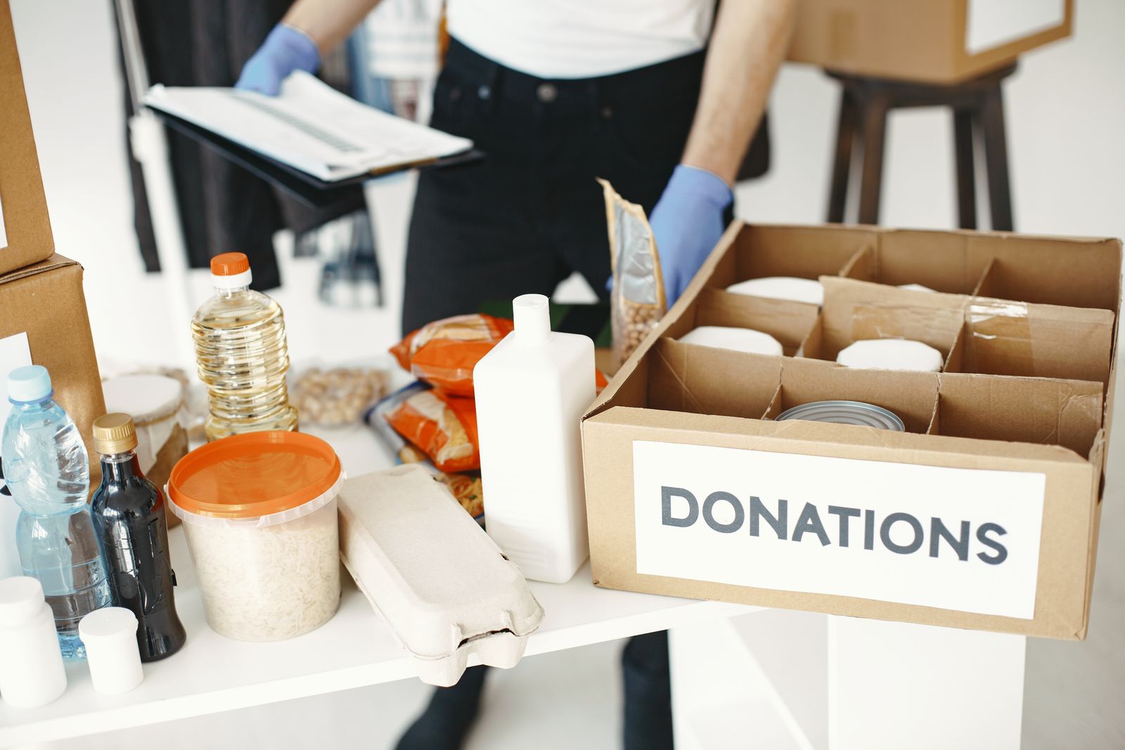 Volunteers packing a community donations box